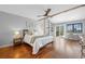 Serene main bedroom with hardwood floors, a vaulted ceiling, and a private balcony entrance at 5531 S Telluride Ct, Centennial, CO 80015