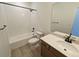 Clean bathroom featuring a shower over bath, modern fixtures, and a vanity with good storage at 8326 Cokedale Cir, Littleton, CO 80125