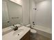 Neat bathroom showcasing a modern vanity, shower-over-bath, and contemporary fixtures at 8326 Cokedale Cir, Littleton, CO 80125