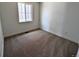Simple bedroom with soft carpet, neutral walls, and a window for natural light at 8326 Cokedale Cir, Littleton, CO 80125