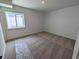 Cozy bedroom with soft carpet, neutral walls, and a window providing ample natural light at 8326 Cokedale Cir, Littleton, CO 80125