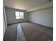 Generously-sized bedroom with carpet, neutral walls, and a window overlooking the neighborhood at 8326 Cokedale Cir, Littleton, CO 80125