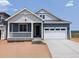 Charming single-Gathering home with a covered porch and a two-car garage, painted in pleasing neutral colors at 8326 Cokedale Cir, Littleton, CO 80125