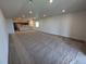 Open-concept living room with recessed lighting and kitchen in the background at 8326 Cokedale Cir, Littleton, CO 80125