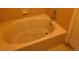 A tiled bathtub is nestled in a yellow-tiled alcove at 4760 S Wadsworth # 301, Littleton, CO 80123