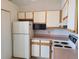 Practical kitchen layout with a refrigerator, microwave, and essential appliances at 4760 S Wadsworth # 301, Littleton, CO 80123