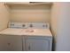 Convenient laundry room with a standard washer and dryer at 4760 S Wadsworth # 301, Littleton, CO 80123