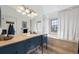 Elegant bathroom with dual sinks, stylish vanity, bathtub, large mirror, and unique lighting fixtures at 7450 W Coal Mine Ave # D, Littleton, CO 80123