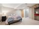 Cozy bedroom with carpet floors, a bed, and shelves at 7450 W Coal Mine Ave # D, Littleton, CO 80123