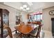 Dining area featuring a chandelier and easy access to the kitchen at 7450 W Coal Mine Ave # D, Littleton, CO 80123