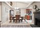 Elegant dining room featuring a tray ceiling and views of the kitchen at 7450 W Coal Mine Ave # D, Littleton, CO 80123