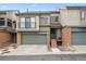 Charming townhome featuring a two-car garage and inviting front porch at 7450 W Coal Mine Ave # D, Littleton, CO 80123