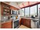 Modern kitchen featuring stainless steel appliances and granite countertops at 7450 W Coal Mine Ave # D, Littleton, CO 80123