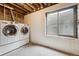 Basement laundry room featuring a washer and dryer at 7450 W Coal Mine Ave # D, Littleton, CO 80123