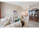 Open living room featuring vaulted ceilings, hardwood floors, and comfortable seating at 7450 W Coal Mine Ave # D, Littleton, CO 80123