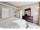 Serene main bedroom with comfortable bed, dresser, and indirect lighting, providing a calm and restful retreat at 7450 W Coal Mine Ave # D, Littleton, CO 80123