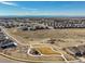Aerial view of a residential neighborhood with a community park and walking trails at 8784 S Riviera Ct, Aurora, CO 80016