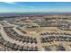 Wide aerial view of a new residential neighborhood and the mountains in the distance at 8784 S Riviera Ct, Aurora, CO 80016