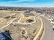 Aerial view of a neighborhood park with a gazebo, walking trails, and landscaping at 8784 S Riviera Ct, Aurora, CO 80016