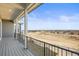 View from the outdoor balcony with a metal railing overlooking the surrounding neighborhood at 8784 S Riviera Ct, Aurora, CO 80016