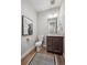 Cozy half bathroom features stylish art, modern fixtures, and a vanity at 8784 S Riviera Ct, Aurora, CO 80016