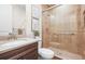 Modern bathroom features a tiled walk-in shower, updated vanity and sink, and stylish decor at 8784 S Riviera Ct, Aurora, CO 80016