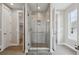 Modern bathroom with frameless glass shower, tiled walls, and contemporary design at 8784 S Riviera Ct, Aurora, CO 80016