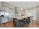 Large kitchen island with stainless appliances and seating at 8784 S Riviera Ct, Aurora, CO 80016