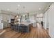 Modern kitchen with an island and a bar, stainless appliances, and sleek cabinets at 8784 S Riviera Ct, Aurora, CO 80016