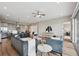 Spacious living area with modern decor, wood floors, and seamless flow to kitchen at 8784 S Riviera Ct, Aurora, CO 80016