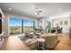 A lovely living room features a large window overlooking the surrounding community at 8784 S Riviera Ct, Aurora, CO 80016