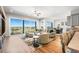 A lovely living room features a large window overlooking the surrounding community at 8784 S Riviera Ct, Aurora, CO 80016