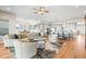 An open concept floor plan with a kitchen, living room and dining area provides seamless living at 8784 S Riviera Ct, Aurora, CO 80016