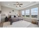 Inviting main bedroom features natural light, tray ceiling, and neighborhood views at 8784 S Riviera Ct, Aurora, CO 80016