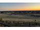 Wonderful view of the neighborhood with rolling hills in the distance at sunset at 8784 S Riviera Ct, Aurora, CO 80016