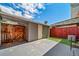 Backyard features storage shed, artificial grass, and concrete patio at 3806 S Yosemite St, Denver, CO 80237