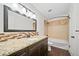 Bathroom with vanity, bathtub and shower with tile at 3806 S Yosemite St, Denver, CO 80237