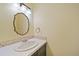 Bathroom featuring decorative mirror and tiling detail at 3806 S Yosemite St, Denver, CO 80237
