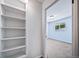 Bedroom entrance with built in shelving at 3806 S Yosemite St, Denver, CO 80237