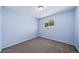 Bedroom with neutral carpet and blue walls at 3806 S Yosemite St, Denver, CO 80237