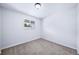 This bedroom features carpet flooring and a window that lets in natural light at 3806 S Yosemite St, Denver, CO 80237