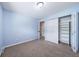 Bedroom with neutral carpet and closets at 3806 S Yosemite St, Denver, CO 80237