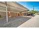 This is a covered parking carport with assigned parking spots, and surrounding buildings at 3806 S Yosemite St, Denver, CO 80237