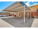 This is a covered parking carport with assigned parking spaces, and surrounding buildings at 3806 S Yosemite St, Denver, CO 80237