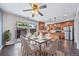 Dining area showcases modern chairs, a marble table, and kitchen views at 3806 S Yosemite St, Denver, CO 80237