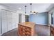 Open kitchen boasts island, and access to laundry and bedroom at 3806 S Yosemite St, Denver, CO 80237