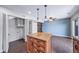 Open kitchen boasts island, and access to laundry room at 3806 S Yosemite St, Denver, CO 80237