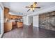 Open kitchen featuring wood cabinets, stainless steel appliances, and an island at 3806 S Yosemite St, Denver, CO 80237