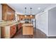 Kitchen features granite countertops, stainless steel appliances, and wood cabinetry at 3806 S Yosemite St, Denver, CO 80237