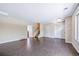 Open-concept living room with hardwood floors, neutral paint, and ample space at 3806 S Yosemite St, Denver, CO 80237